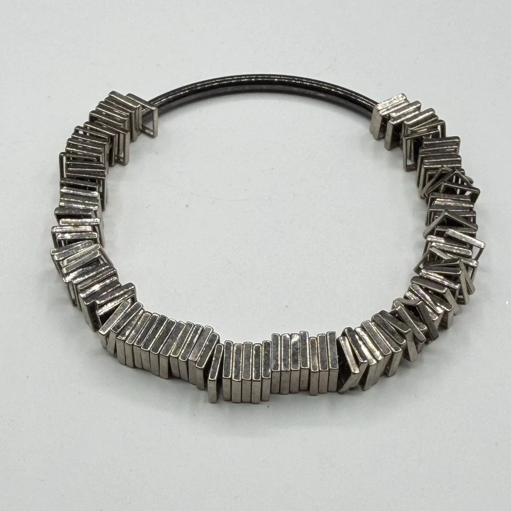 N/A sculptural silver